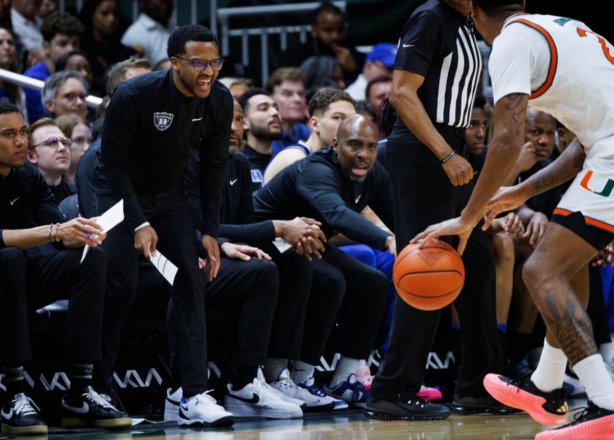 Jai Lucas, current Duke University Assistant Basketball Coach, and new Miami Hurricanes Head Coach, yells to his current his players during the first half of a game against the Miami (Fl) Hurricanes on Tuesday, Feb. 25, 2025, at Watsco Center in Coral Gables, Fla.