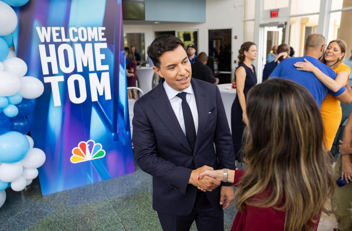 Tom Llamas, a broadcast journalist, greets staff as he visits the NBC Miami newsroom on Thursday, May 1, 2025, in Miramar, Fla. Llamas, who previously worked at this station, is replacing Lester Holt as the anchor and managing editor of NBC Nightly News.