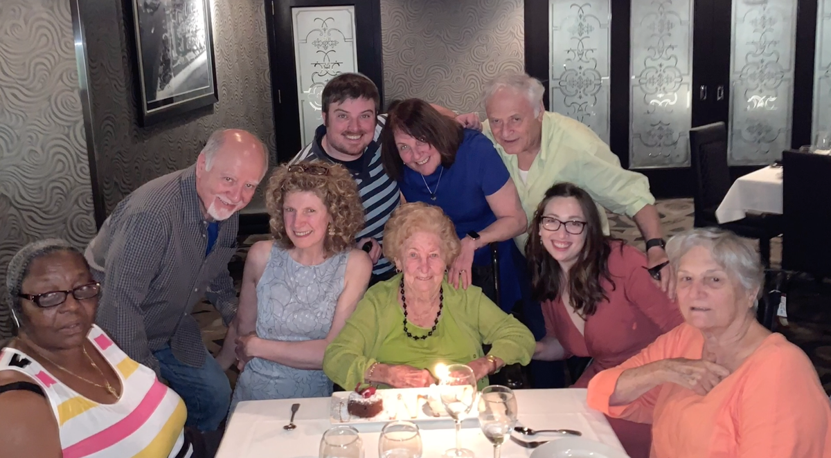 Hilda Frenkel, a Hallandale Beach resident who will turn 100 on Sunday, with her family. She will be celebrating her birthday virtually due to the Covid-19 pandemic.