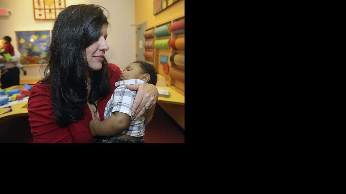 
Denise Sasiain of Miami cradles her youngest son, 8-month-old Jacob, shortly after she and husband Pierre Sasiain adopted him on Friday, Nov. 21, 2014 at the Miami Children's Museum. The adoption was part of National Adoption Day, a nationwide program to bring attention to foster children needing to be adopted. Jacob, who was found in a shopping cart, joins siblings Isabella, 5, Daniella, 2-1/2, and Xavier, who turns 4 on Sunday. 


