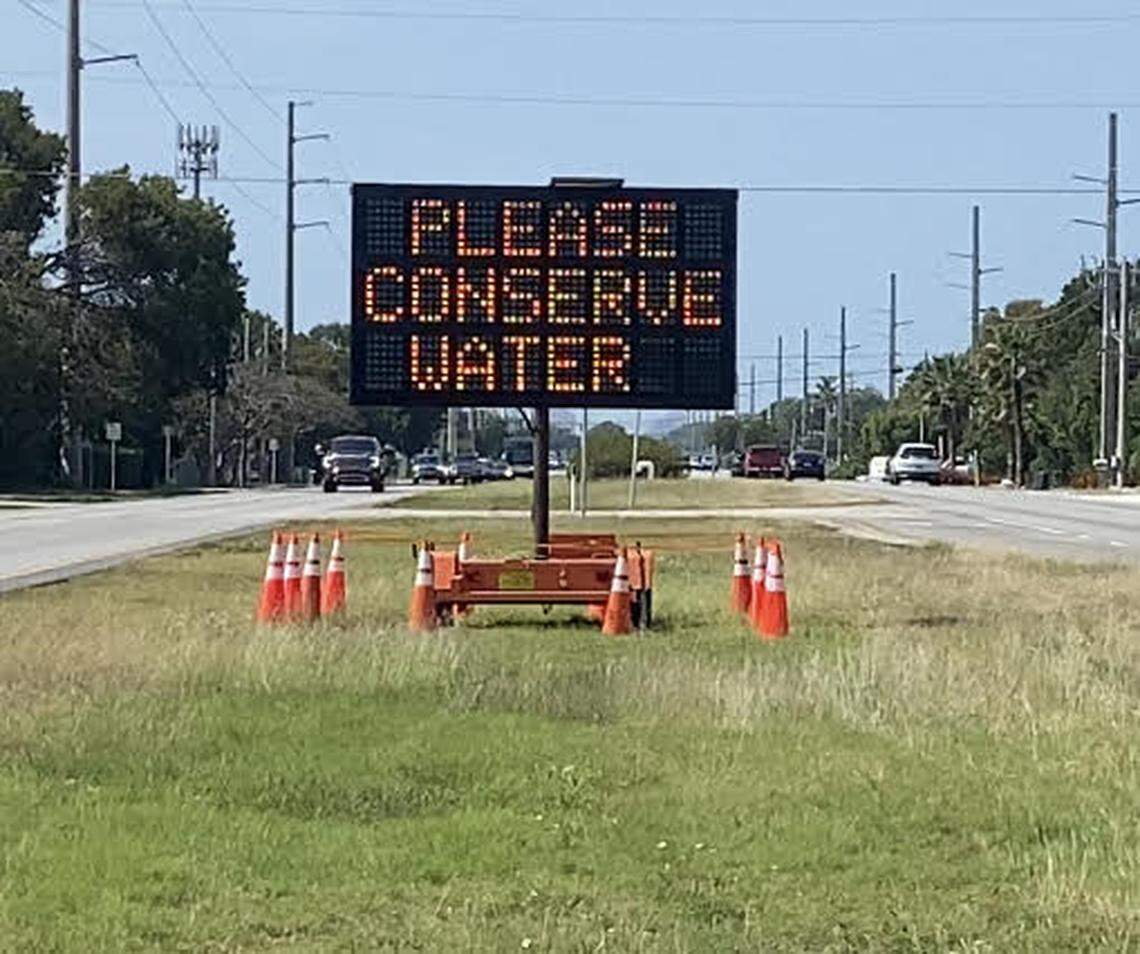 A sign in the median of U.S. 1 in Key Largo Tuesday, March 14, 2023, urges residents and visitors in the Florida Keys to conserve water.