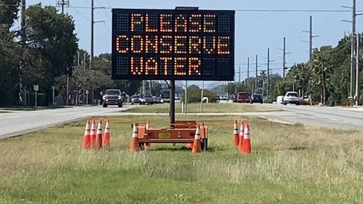 A sign in the median of U.S. 1 in Key Largo Tuesday, March 14, 2023, urges residents and visitors in the Florida Keys to conserve water.