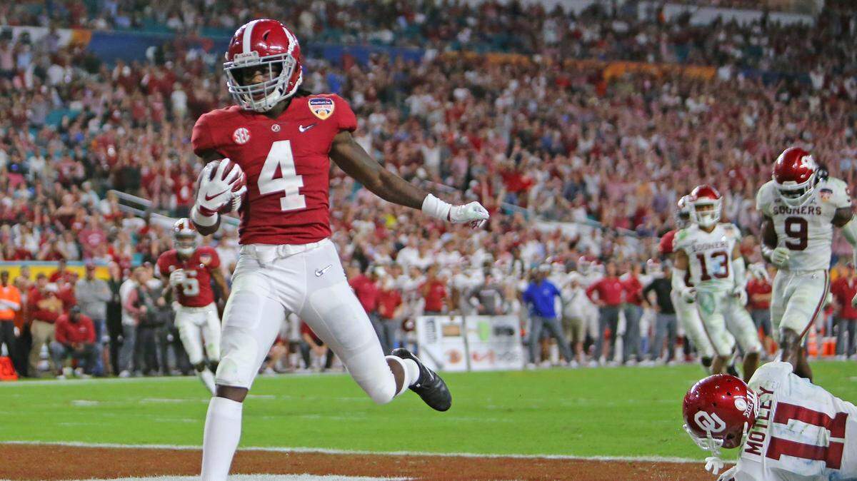 Alabama Crimson Tide wide receiver Jerry Jeudy (4) scores a touchdown against the defense of Oklahoma Sooners cornerback Parnell Motley (11) during fourth quarter of the College Football Playoff Semifinal at the Orange Bowl game at Hard Rock Stadium on Saturday, December 29 2018, in Miami Gardens.