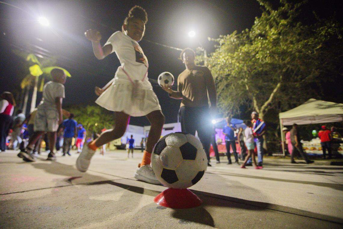 (Center) Makaila Lee,  6 yeras old, kicks the ball during  Haitian World Cup Block Party at the Little Haiti Cultural Center in Little Haiti on Saturday, November 22, 2025.