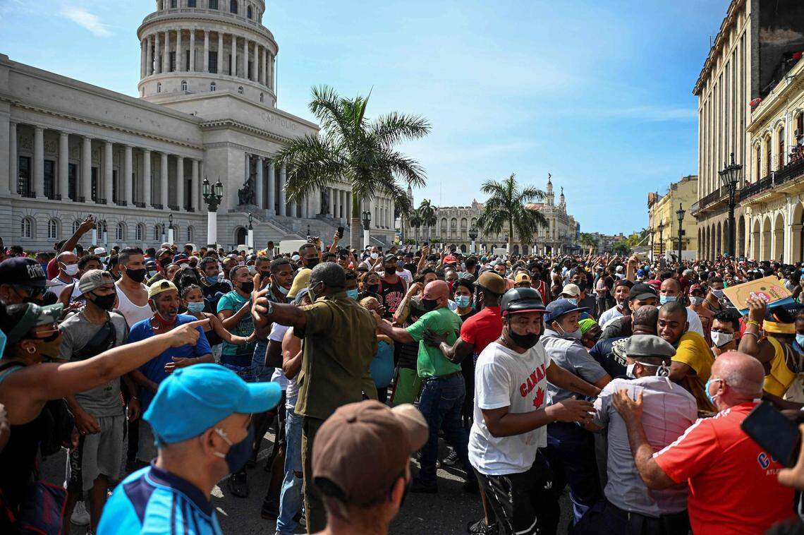 People take part in a demonstration against the government of Cuban President Miguel Diaz-Canel in Havana, on July 11, 2021. - Thousands of Cubans took part in rare protests Sunday against the communist government, marching through a town chanting “Down with the dictatorship” and “We want liberty.” (Photo by YAMIL LAGE / AFP) (Photo by YAMIL LAGE/AFP via Getty Images)