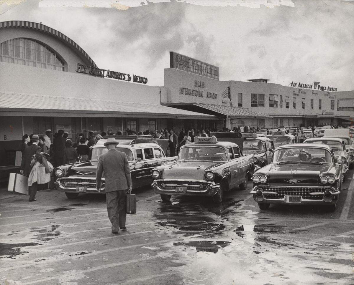 Tourists arrive at Miami International Airport.