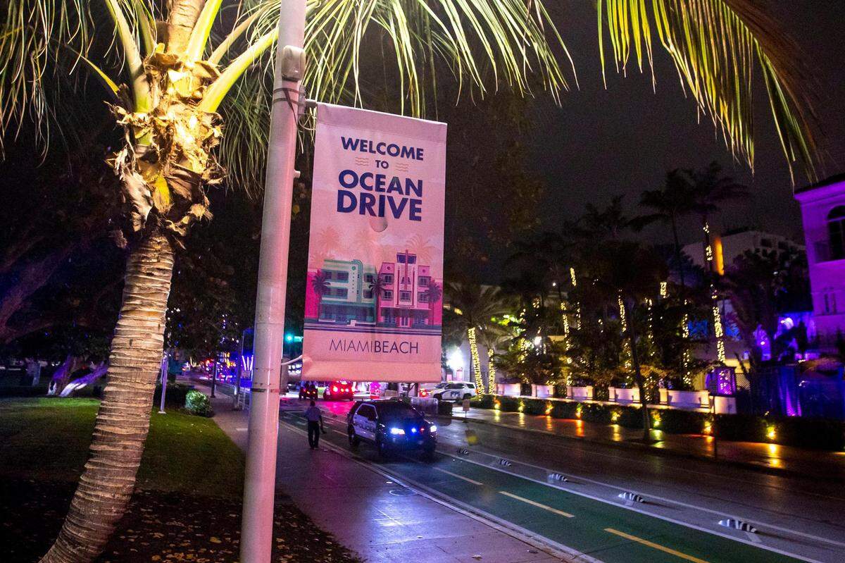 Miami Beach Police clear Ocean Drive because the City of Miami Beach imposed a curfew at midnight to curb violence during Spring Break in Miami Beach, Florida, on Thursday, March 24, 2022.
