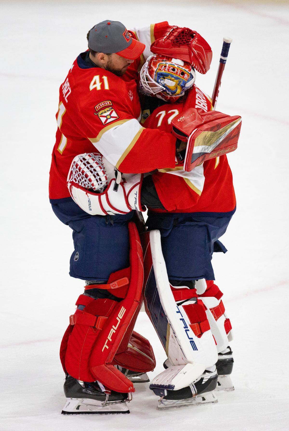 Florida Panthers goaltender Anthony Stolarz (41) hugs winning goaltender Sergei Bobrovsky (72) after Game 1 against the Tampa Bay Lightning during the Stanley Cup Playoffs on Sunday, April 21, 2024, at Amerant Bank Arena in Sunrise, Fla. The Panthers won 3-2. 
