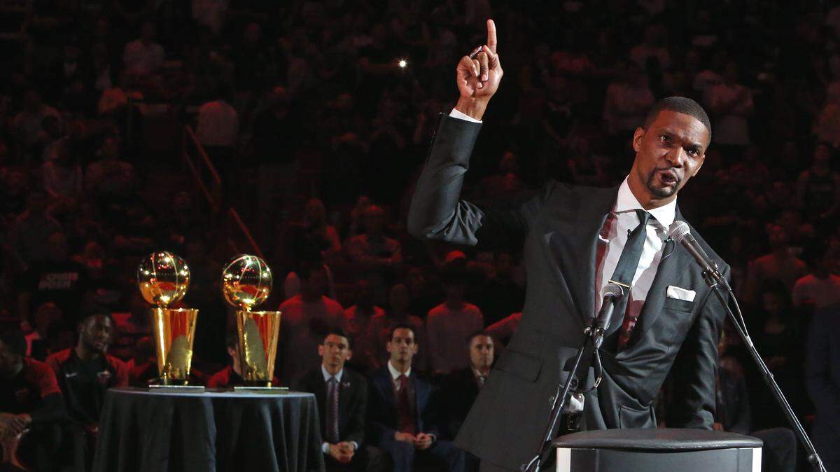 Former Miami Heat Chris Bosh speaks during a ceremony to retire his number at halftime of an NBA basketball game against the Orlando Magic at the AmericanAirlines Arena on Tuesday, March 26, 2019 in Miami.