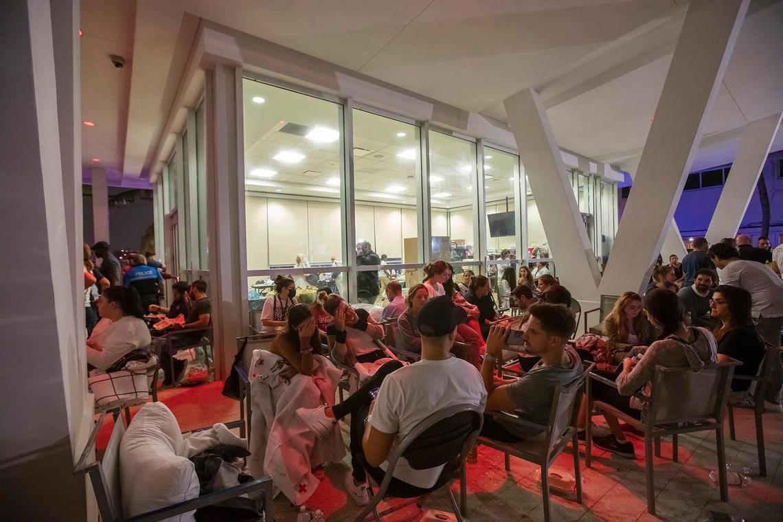 Family and friends wait for for updates at a reunification center at 9301 Collins Ave in Surfside during the search-and-rescue operation after the partial collapse of the Champlain Towers South in Surfside on Thursday June 24th., 2021.