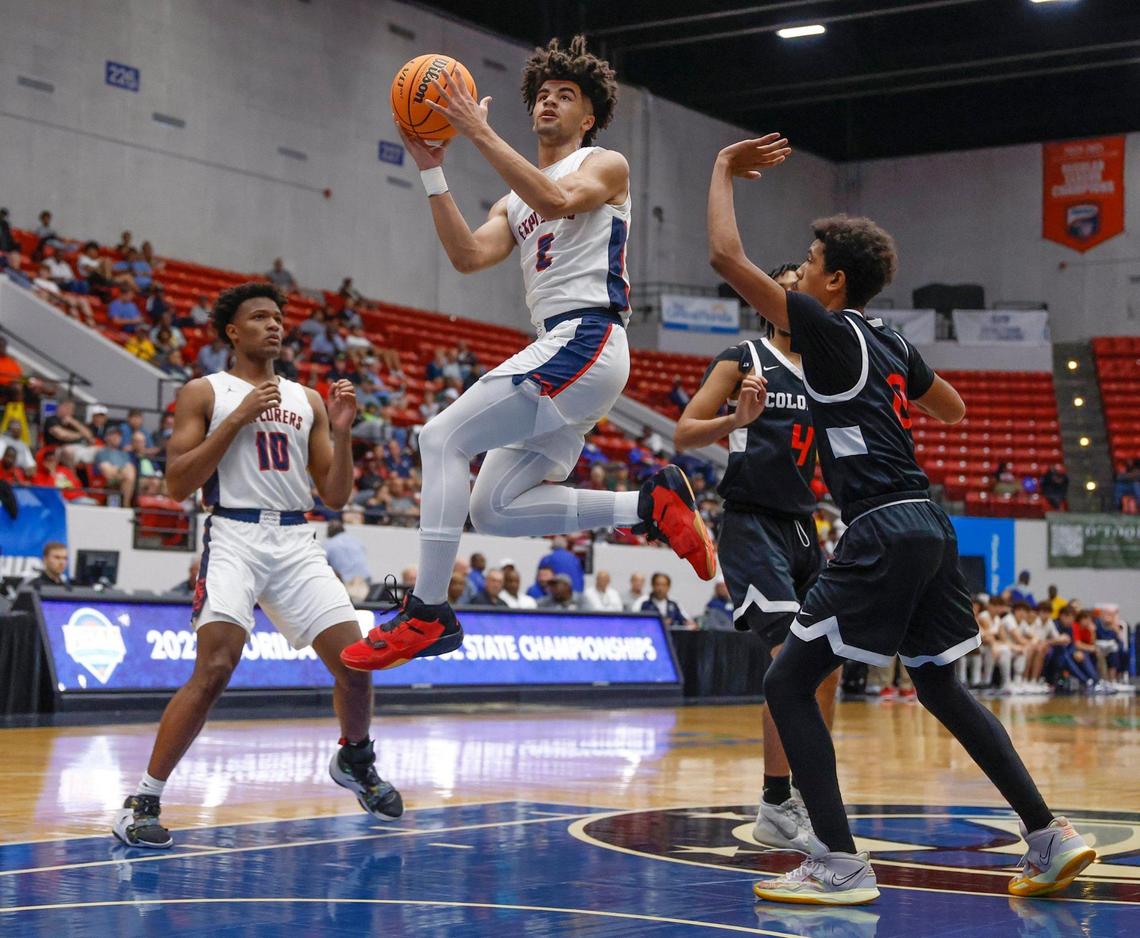 Columbus Explorers Cayden Boozer (2) leaps to score in the first quarter against Colonial High School during the FHSAA semifinal at the RP Funding Center in Lakeland, Florida on Friday, March 3, 2023.