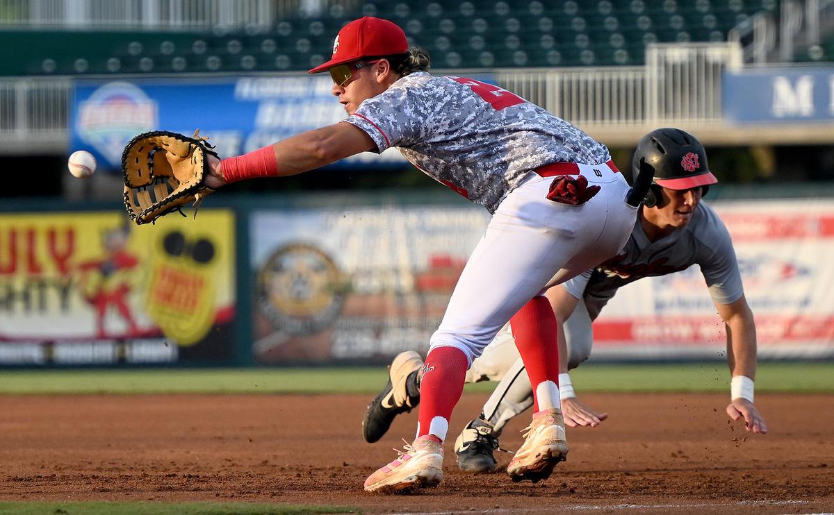 Miami Christian first basemen Jonathan Gonzalez(2) tries to tag out North Florida Christian Joshua Schuchts (22) in a class 2A baseball championship game in Fort Myers ,Tuesday, May 24, 2022.(Photo/Chris Tilley)