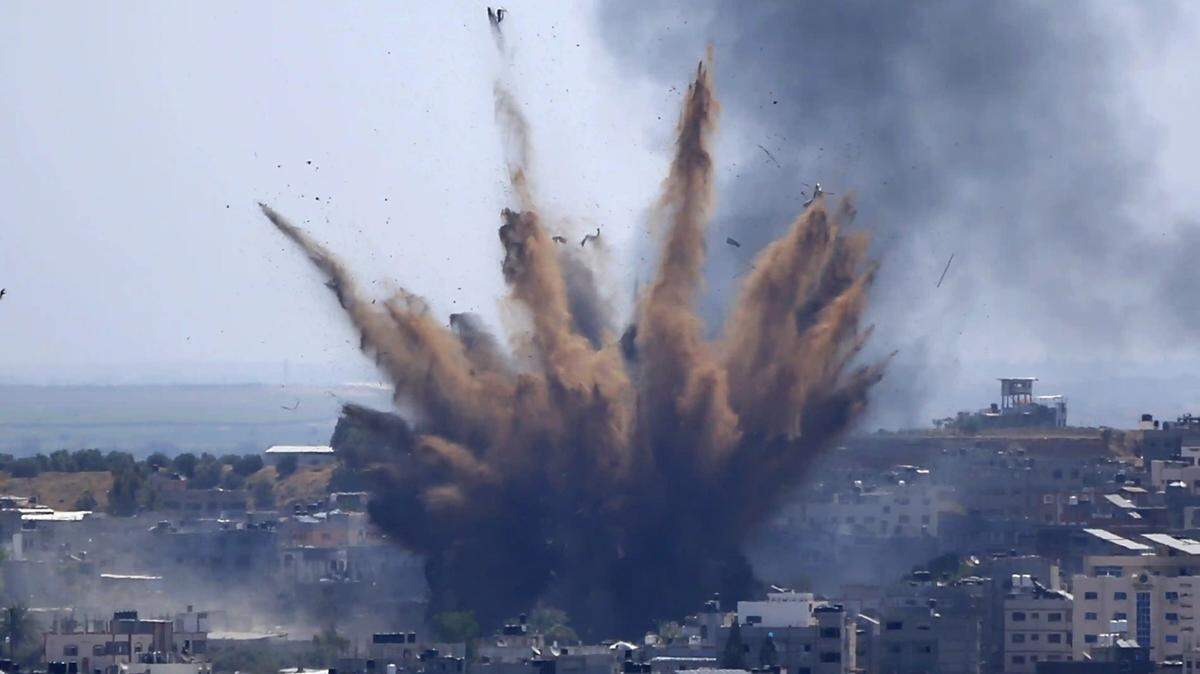 Smoke rises following Israeli airstrikes on a building in Gaza City on April 13.