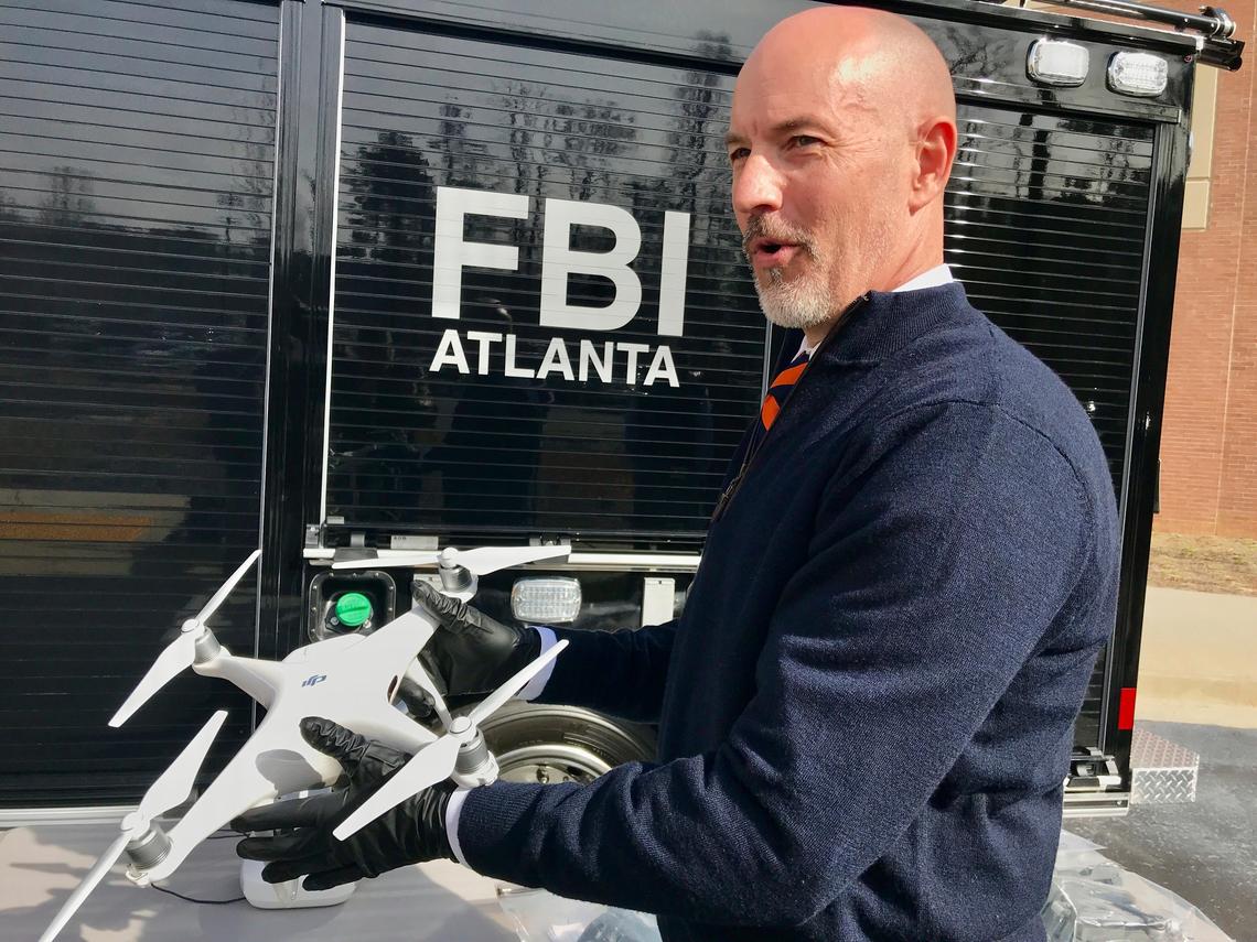 Before the Super Bowl in Atlanta last year, FBI Special Agent John Cronier holds one of a half-dozen drones that were confiscated for being flown in the no-fly zone over Mercedes-Benz Stadium in the days before the game.