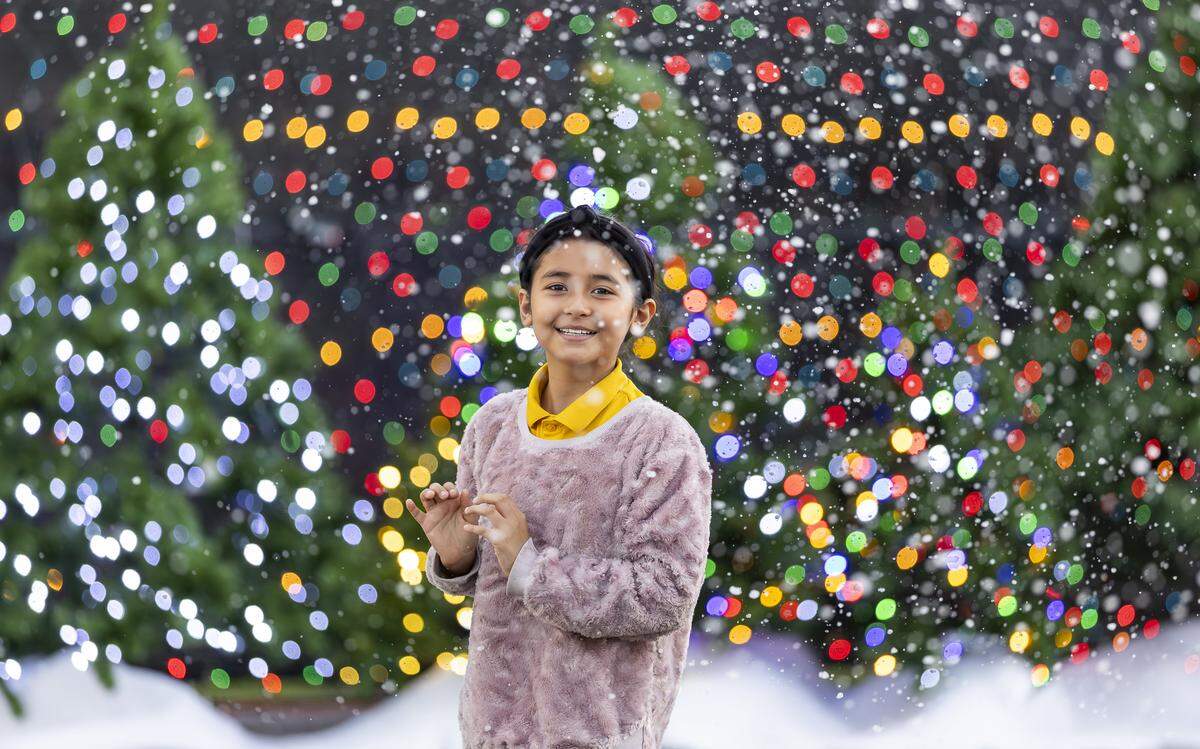 Ylenia Palma, 9, is photographed as she arrives to the grand opening of Ripley's Believe It or Not! Christmas Park at Amelia Earhart Park on Thursday, Nov. 13, 2025, in Hialeah, Fla.