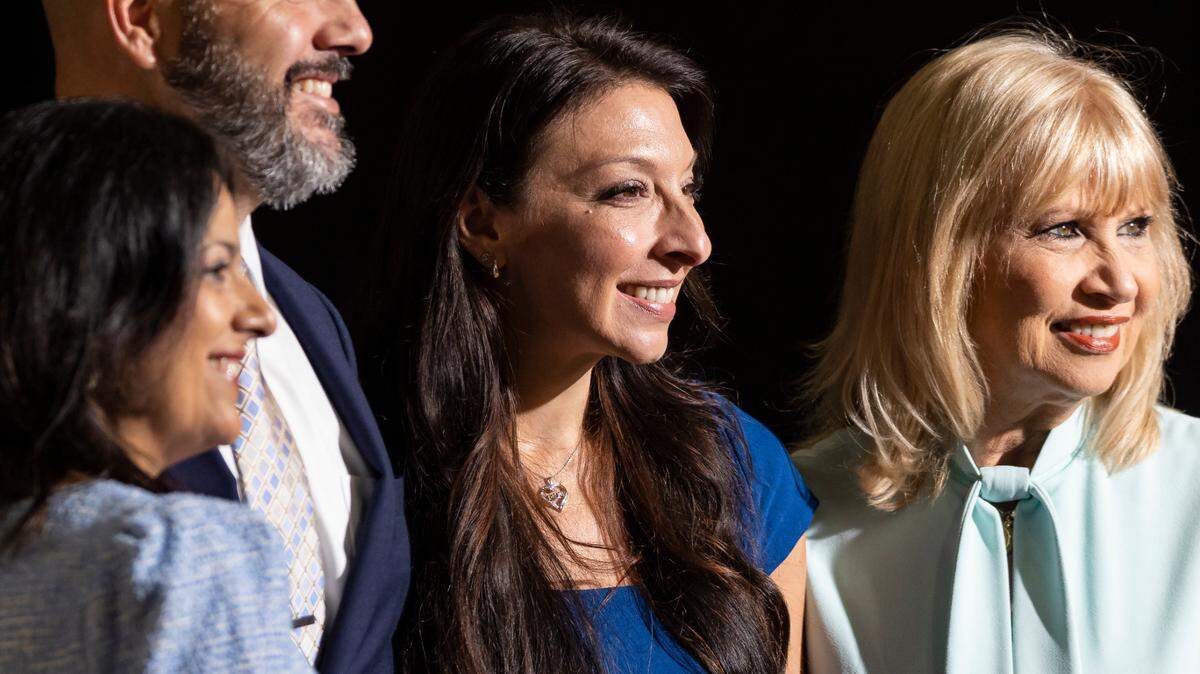 From left to right: District 4 School Board Member Robert Alonso, Erika Donalds, founder of the Optima Foundation, and District 6 School Board Member Mari Tere Rojas attend a press conference by Florida Governor Ron DeSantis at Christopher Columbus High School on Monday, March 27, 2023, in Miami, Fla. The press conference was held to announce DeSantis’s signing of a private school voucher expansion, HB1, which allows more Florida school children become eligible for taxpayer-funded school vouchers.