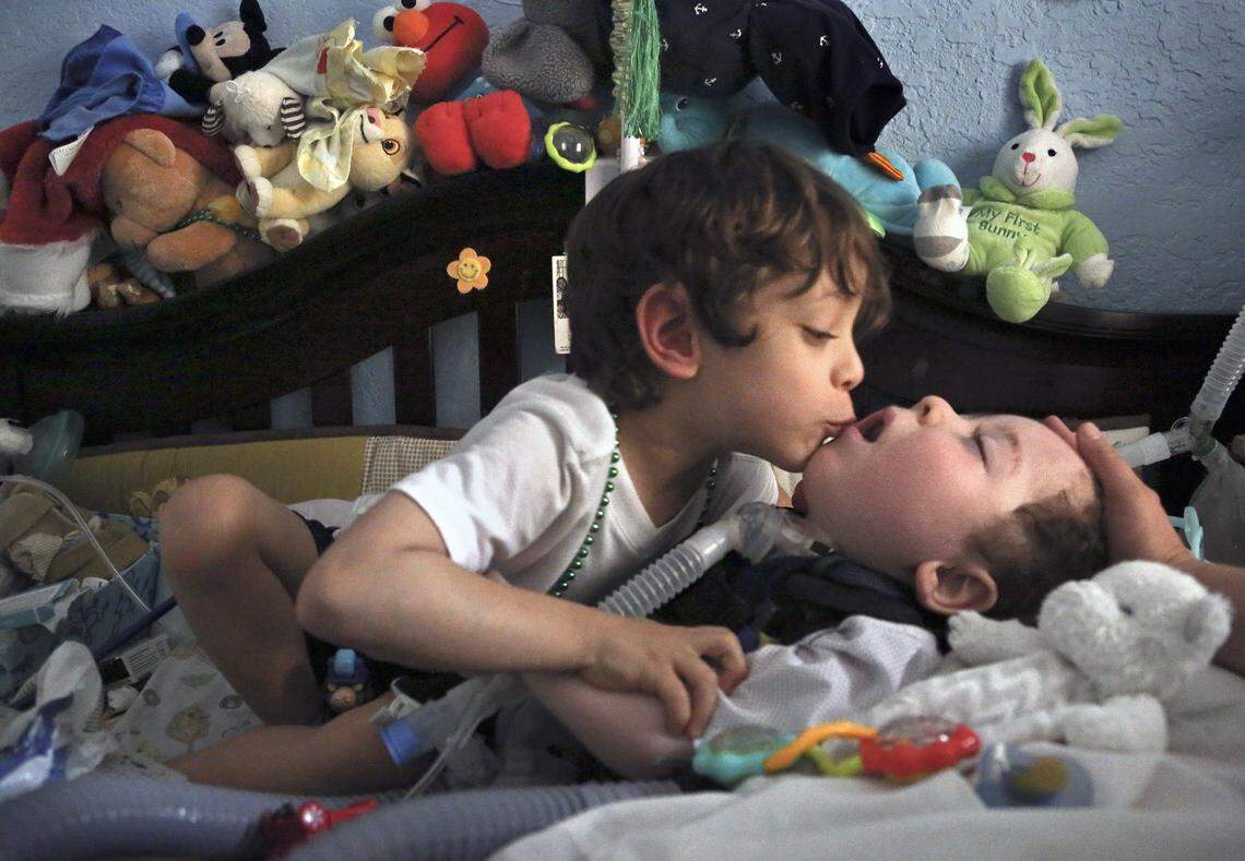 Twin Adrian Quesada, 5, left, shares a special bond with his brother Alejandro Quesada, right, on Dec. 21, 2017.