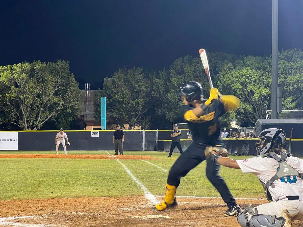 American Heritage catcher Mateo Serna stands in to hit against Archbishop McCarthy during Tuesday’s Region 4-5A final at McCarthy.