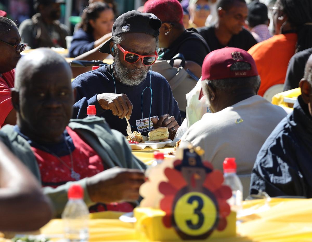 The hungry and the homeless enjoy a feast as thousands of meals were served in Miami-Dade and Broward counties on Thanksgiving Day with the help from 400 volunteers during “The Great Thanksgiving Day Banquet,” an outside block party and outreach effort.
