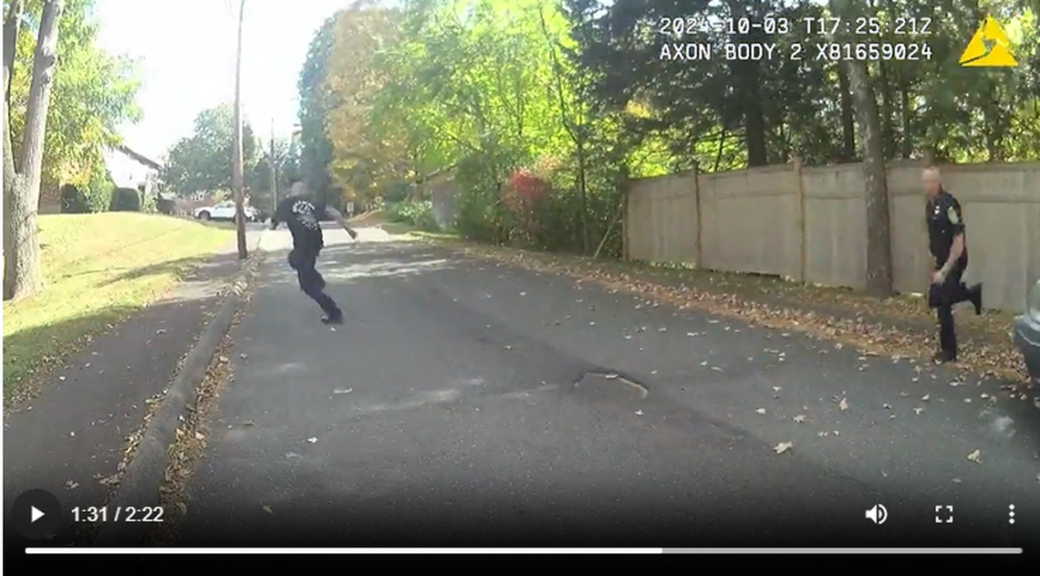 This screengrab shows the moment Officer John Covello began chasing the suspect from the scene of the stabbing, officials say.