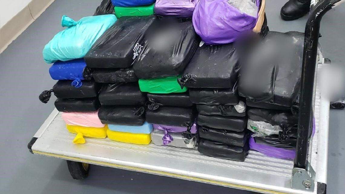 Almost 170 pounds of cocaine is stacked on a cart in a Key West office. The drugs were found aboard a sailboat heading into Key West Monday, June 13, 2023, according to the U.S. Border Patrol.