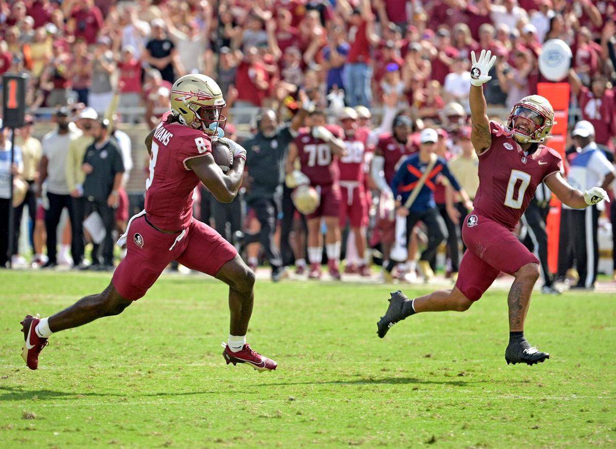 Oct 14, 2023; Tallahassee, Florida, USA; Florida State Seminoles wide receiver Hykeem Williams (8) scores a touchdown as wide receiver Ja’Khi Douglas (0) celebrates during the second half against the Syracuse Orange at Doak S. Campbell Stadium. Mandatory Credit: Melina Myers-USA TODAY Sports