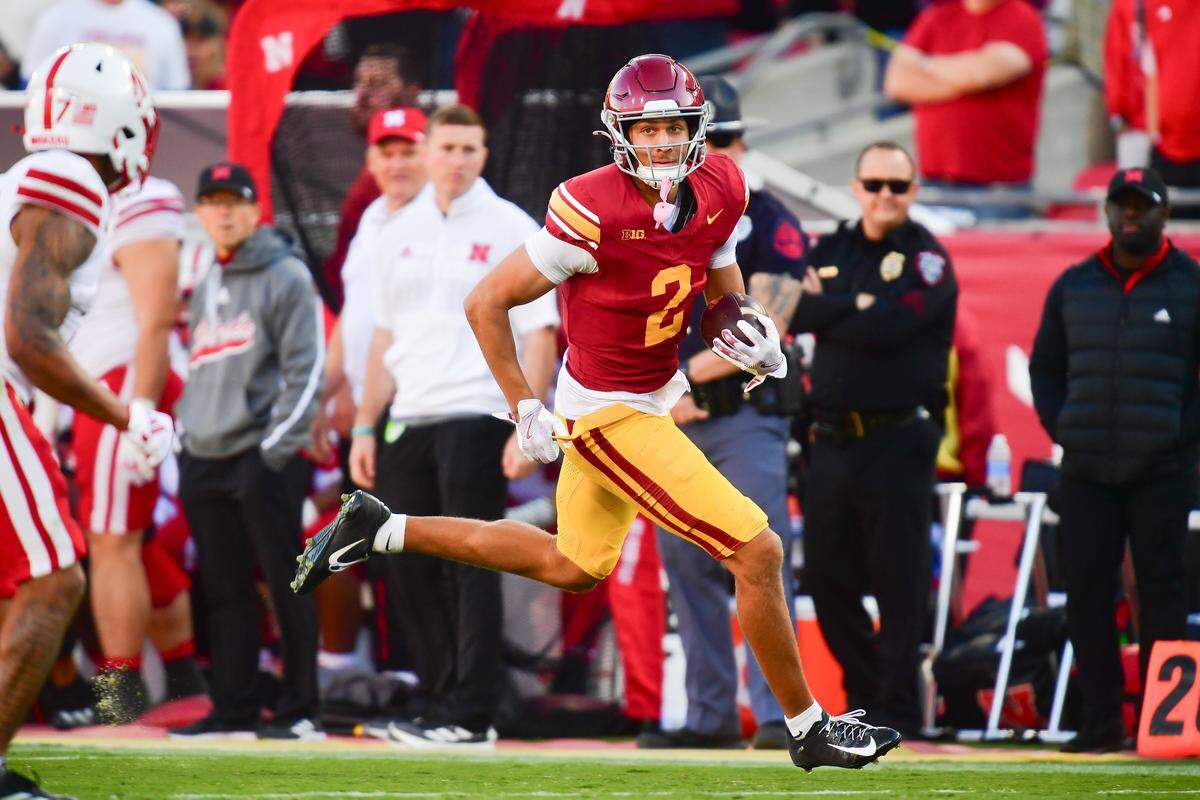 Nov 16, 2024; Los Angeles, California, USA; Southern California Trojans wide receiver Duce Robinson (2) runs the ball against the Nebraska Cornhuskers during the second half at the Los Angeles Memorial Coliseum. Mandatory Credit: Gary A. Vasquez-Imagn Images