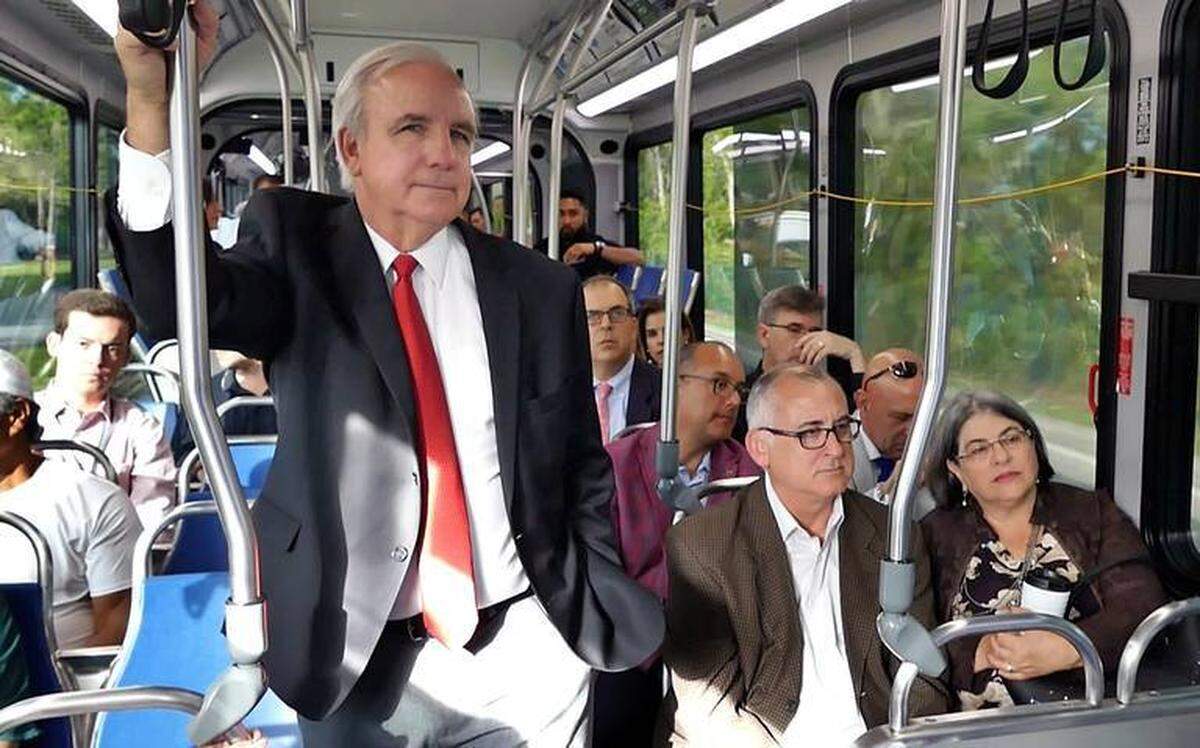 Miami-Dade Mayor Carlos Gimenez and Commissioners Esteban Bovo and Daniella Levine Cava take a ride along the signal-prioritized South Dade Busway.