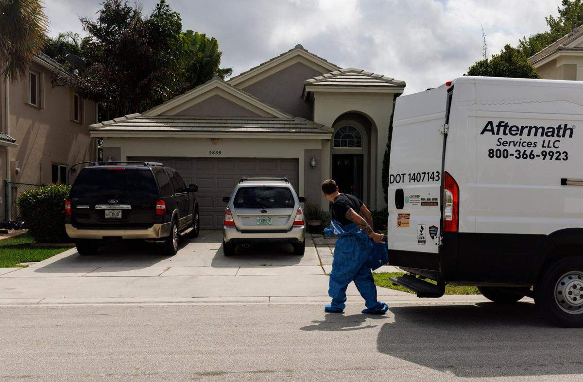 The Tamarac house where Mary Catherine Gingles, 34, and her neighbor Andrew Ferrin, 36, were shot and killed Sunday morning is cleaned by a crew on Tuesday, Feb. 18, 2025. Nathan Gingles, 43, Mary’s estranged husband, is accused of shooting and killing Mary, her father David Ponzer, 64, and Ferrin.