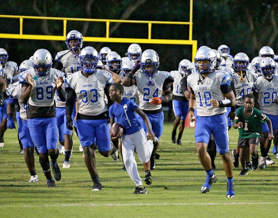 Dillard Panthers take the field for the football game against Plantation Colonels on Friday, October 14, 2022 at PAL Football Complex in Plantation. Andrew Uloza / for Miami Herald