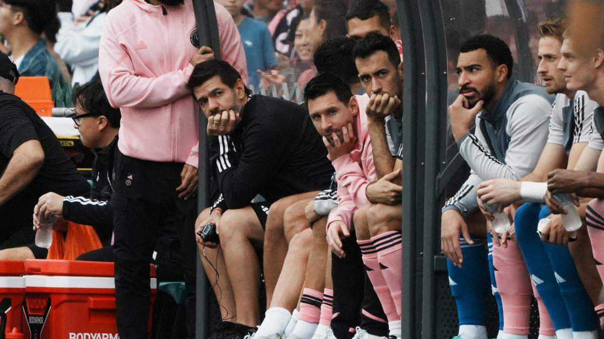 [US, Mexico & Canada customers only] Feb 4, 2024; Hong Kong, HONG KONG; Inter Miami players Lionel Messi, Sergio Busquets and teammates sit on the substitute bench in a preseason friendly soccer match against Hong Kong XI at Hong Kong Stadium. Mandatory Credit: Lam Yik/Reuters via USA TODAY Sports