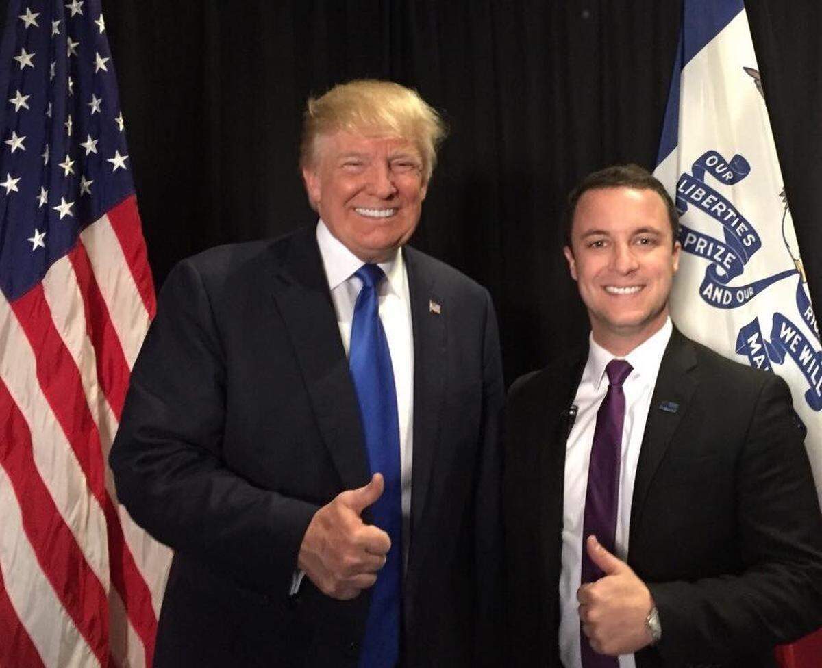 Justin Caporale, director of external affairs in charge of programs and events, with President Donald Trump.