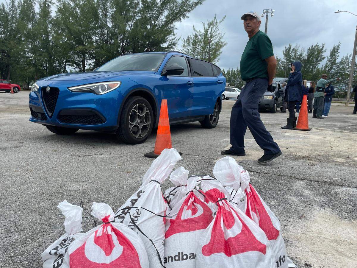People waited in line for nearly two hours Monday morning at Tropical Park to get four free sandbags from a distribution effort set up overnight by the Miami-Dade County Parks Department. Photo taken on Oct. 7, 2024.