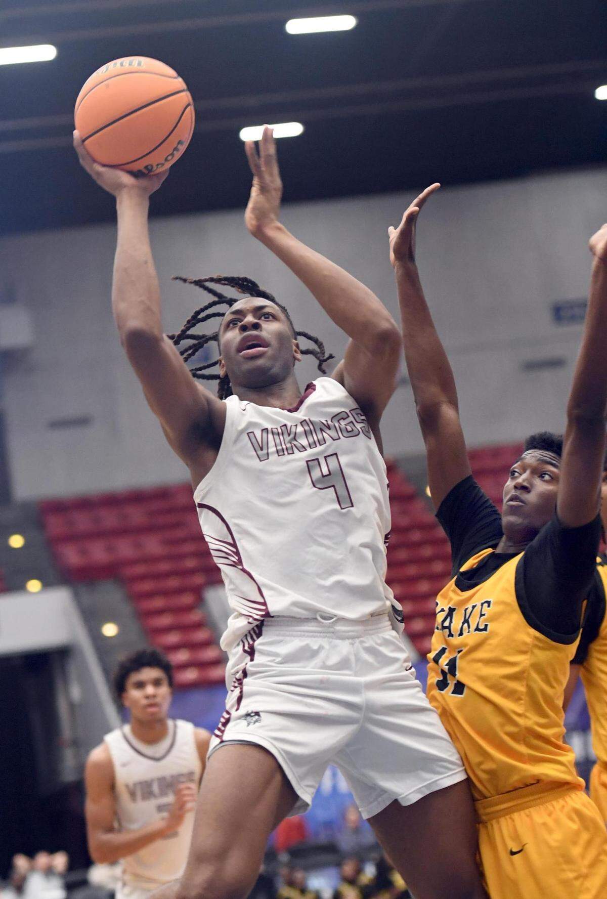 Norland’s Marcus Allen (4) shoots against Blake’s Shamar Council (11) in the Class 5A final during the Florida High School State Championships at the RP Funding Center in Lakeland, Fl on Friday March 8, 2024. Norland defeated Blake 61-48 to win the State Title. Scott Wheeler | Photo