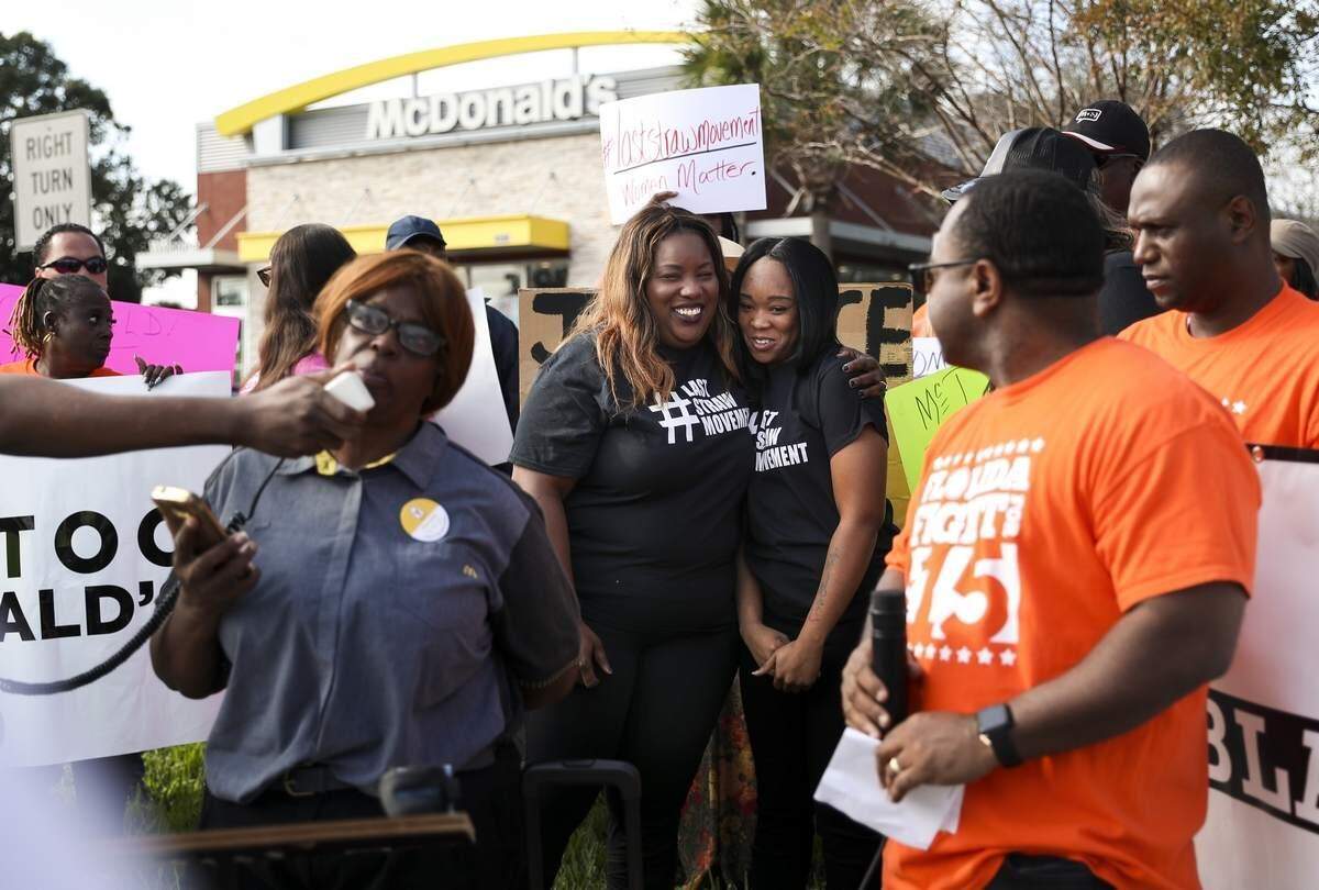 Attorney Michele Rayner-Goolsby (left) hugs Yasmine James, 20, as Ybor City McDonald’s worker Gail Rogers speaks outside the McDonald’s at 4595 34th St. S on Tuesday in St. Petersburg. The group, including fast food workers and people from the Fight for $15 movement gathered to demand protection from physical violence for fast food workers. The gathering was in response to the recent viral video that captured James, who works at the 34th Street McDonald’s, being assaulted by a customer. People chanted, “Respect our women,” and “No more silence, stop the violence.”
