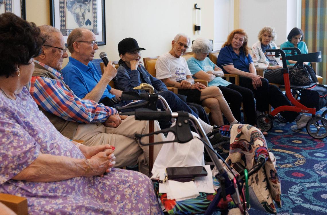 Barry Glassman, center, speaks about the role religion plays in our lives while other residents listen during an Interfaith Conversation Series called “A Reverend and a Rabbi” at Vi at Aventura retirement community.