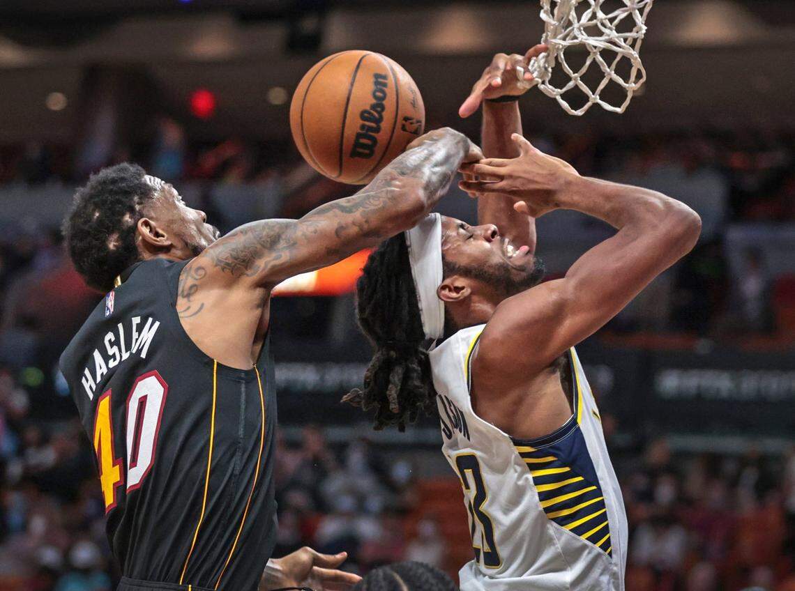 Miami Heat forward Udonis Haslem (40) attempts to block a shot by Indiana Pacers forward Isaiah Jackson (23) in the fourth quarter at the FTX Arena in Miami on Tuesday, December 21, 2021. 