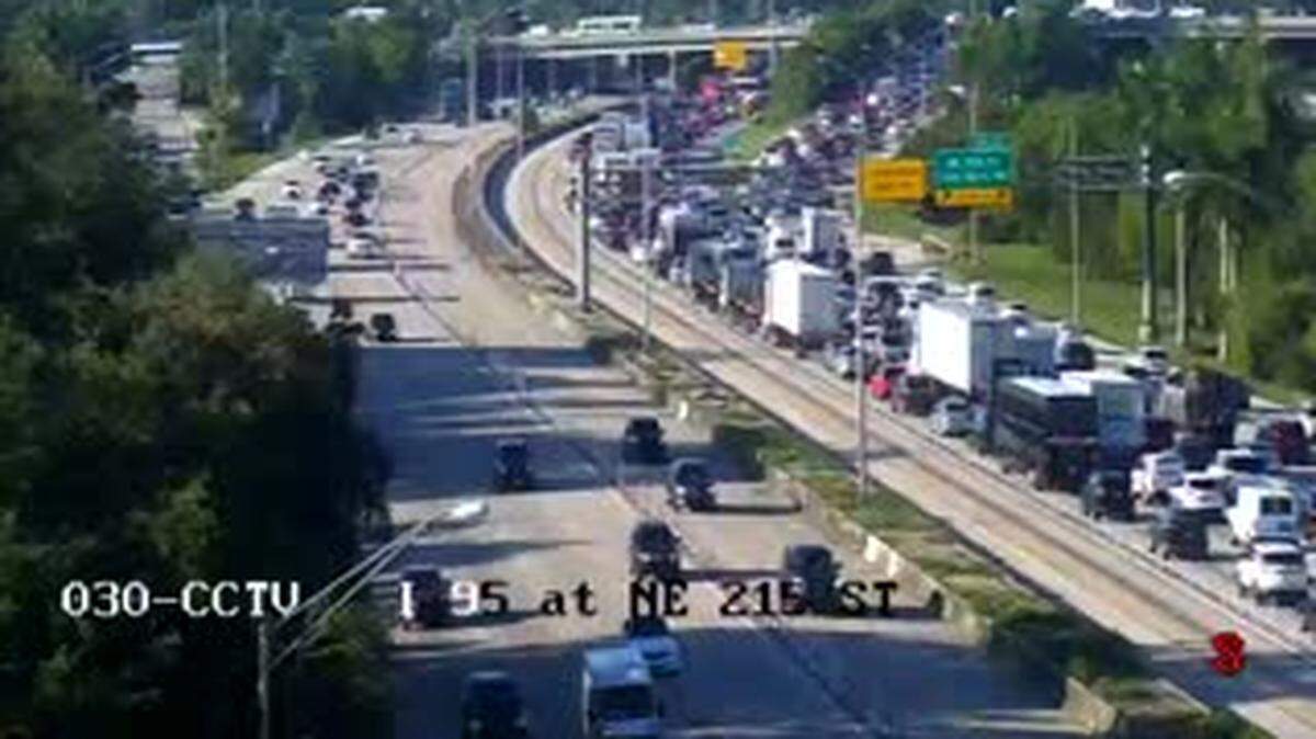 The traffic backup on Interstate 95 southbound from the rollover crash goes back past Ives Dairy Road.
