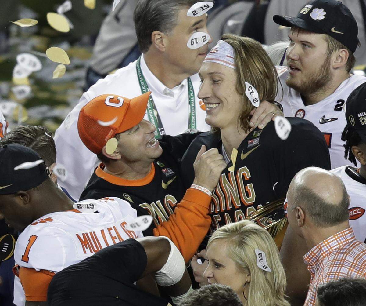 Clemson head coach Dabo Swinney celebrates with Trevor Lawrence after the NCAA college football playoff championship game against Alabama, Monday, Jan. 7, 2019, in Santa Clara, Calif. Clemson beat Alabama 44-16.