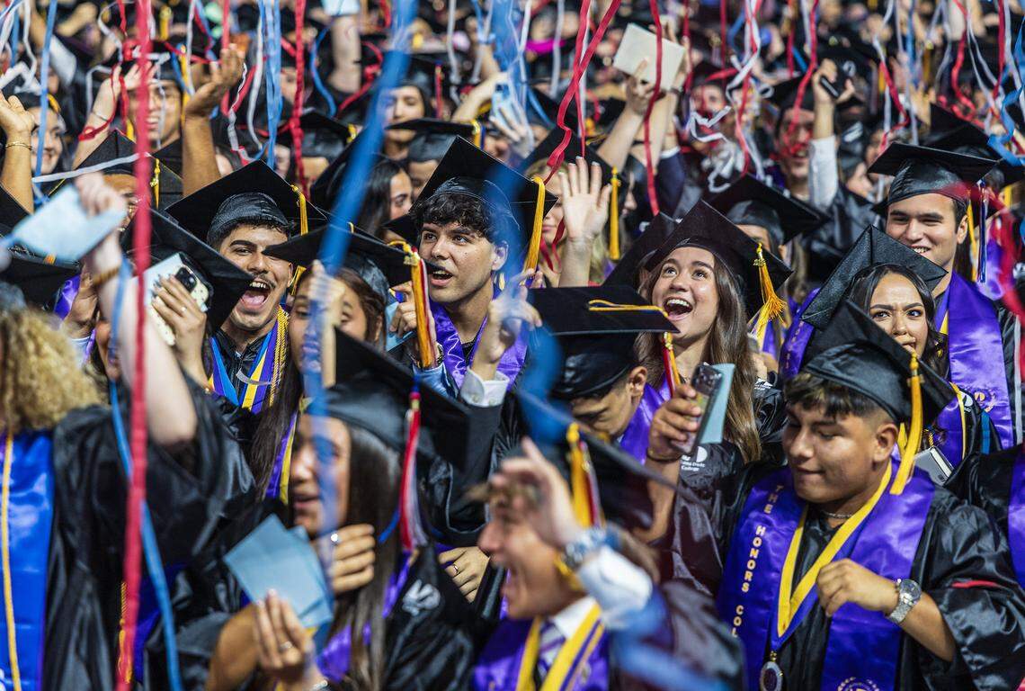 MDC grad students including David Alejandro Ramírez Núñez (center), celebrates earning a degree in Mechanical Engineering a major achievement, as he is heading to MIT during the Miami Dade College's Kendall and Padrón Campuses 2026 Commencement ceremonies at the LoanDepot Park, in Miami on Saturday, April 25, 2026.