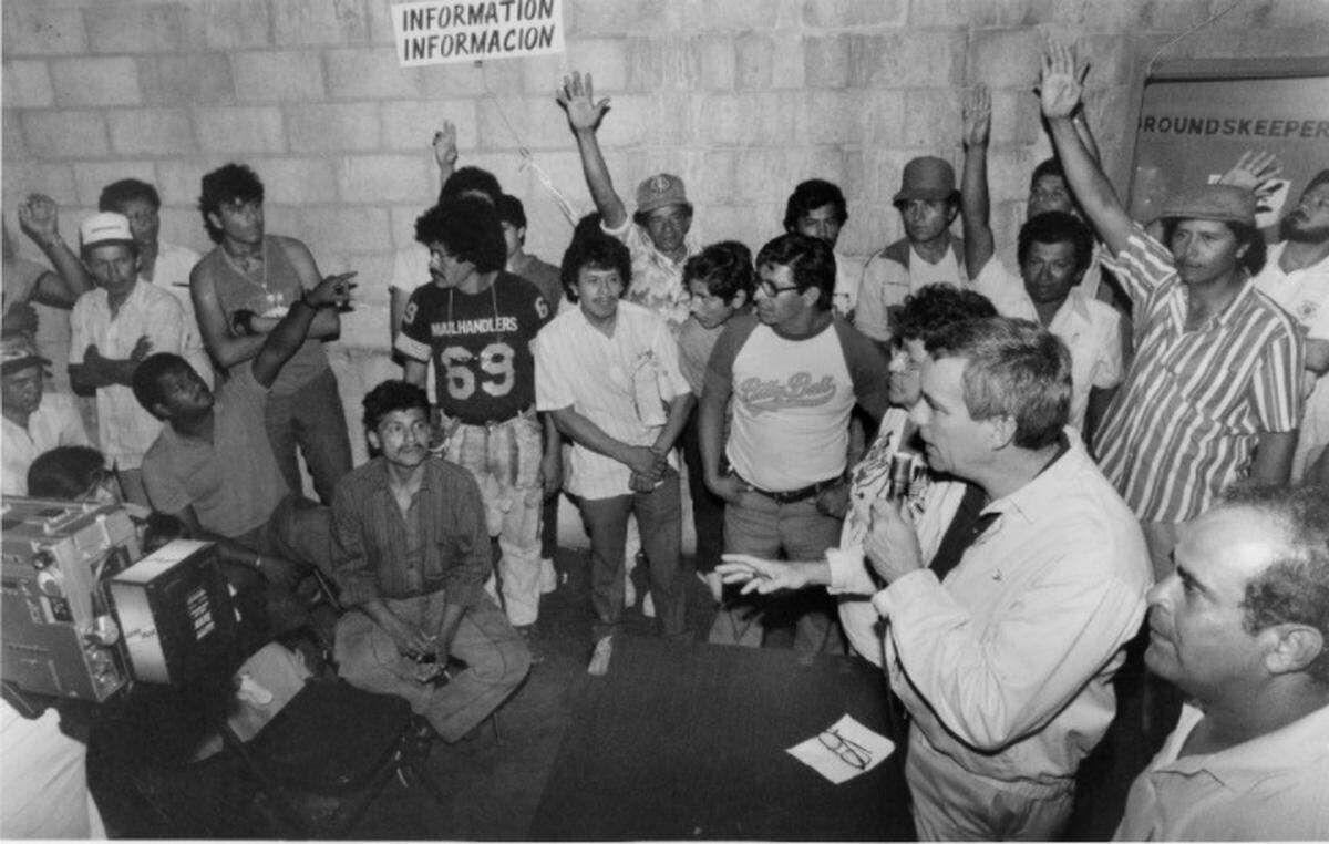 Then Miami City César Odio talks to refugees at the Bobby Maduro Stadium about work permits in this Jan. 11, 1989 file photo. Odio was city manager from 1985 to 1996.
