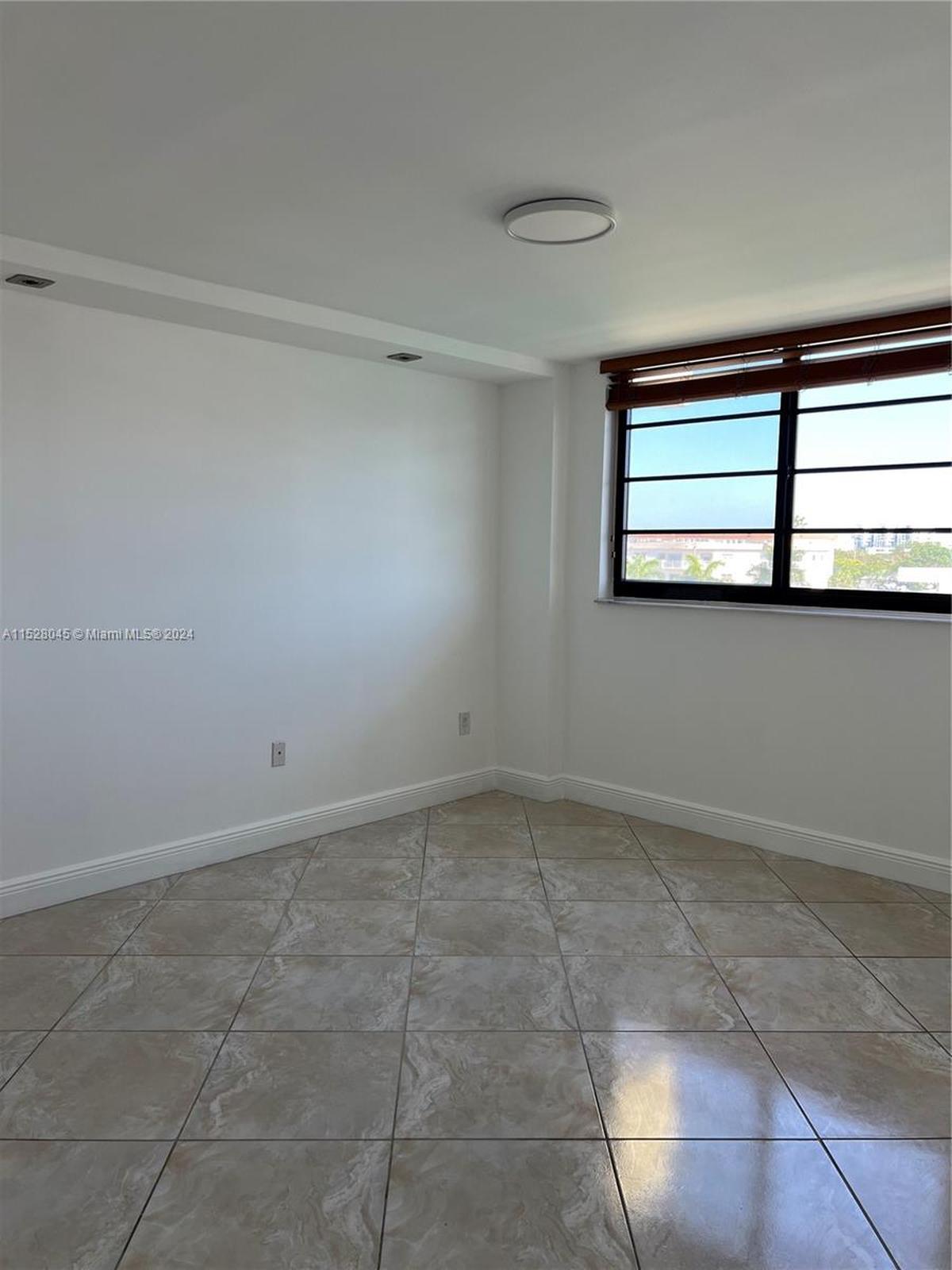 The Normandy Isles apartment has two bedrooms and two bathrooms. All of the apartment’s hurricane-proof windows overlook the intracoastal waterway and high-rises on the mainland in the distance.