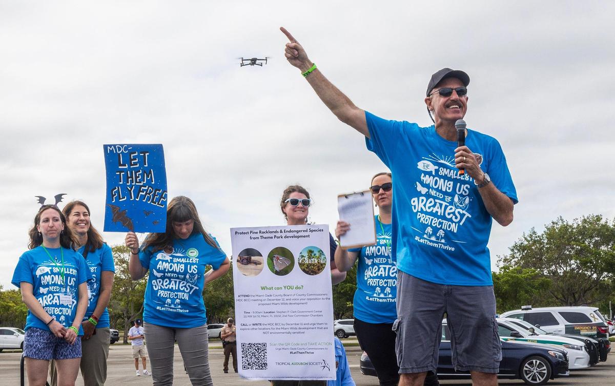 Ron Magill (far right), the communications director at Zoo Miami leads a group of South Florida residents during a rally to convince the Miami-Dade commission to vote against the controversial plan to build the Miami Wilds water park next to Zoo Miami, on Saturday, November 4, 2023.