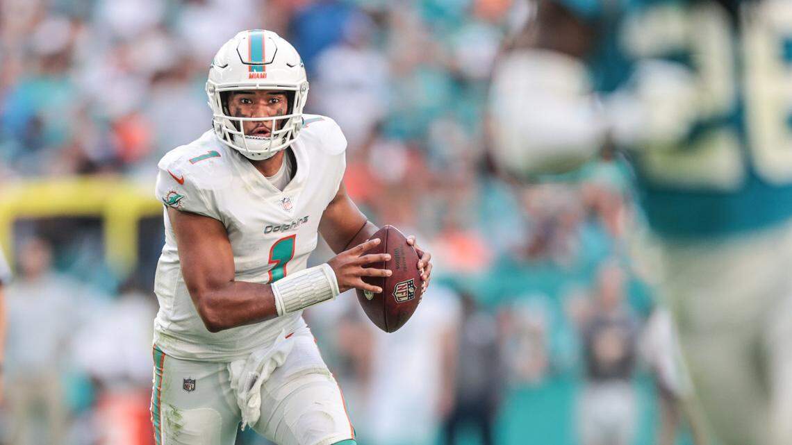 Miami Dolphins quarterback Tua Tagovailoa (1) scrambles in the fourth quarter during game against the Carolina Panthers at Hard Rock Stadium on Sunday, November 28, 2021.