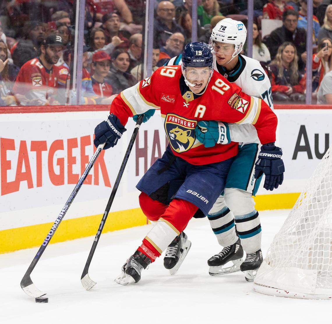 Florida Panthers left wing Matthew Tkachuk (19) and San Jose Sharks center William Eklund (72) compete for the puck in the second period of their NHL game at the Amerant Bank Arena on Tuesday, Oct. 24, 2023, in Sunrise, Fla.
