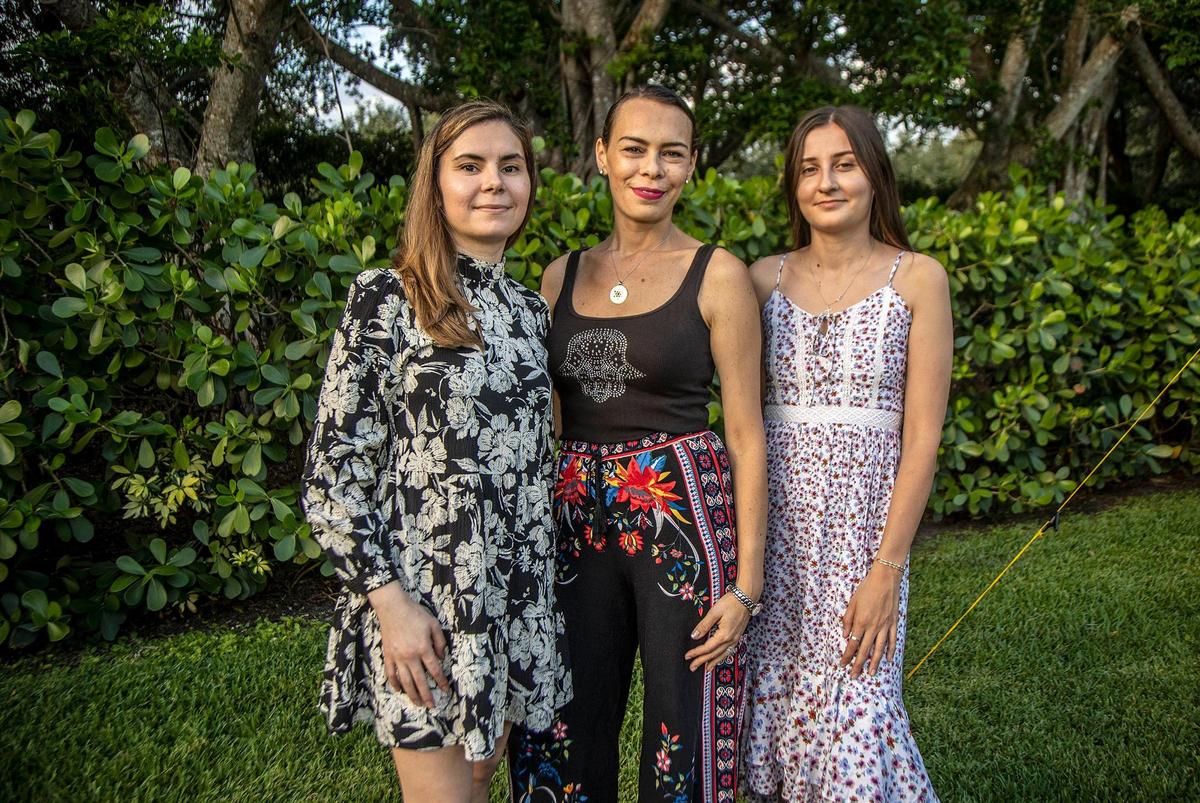 Angie Watstein, center, with the temple B’nai Aviv, poses with Juliet Bedard, left, and Kateryna Tserkovniuk, both with the St. Nicholas Ukrainian Orthodox Church in Cooper City, at the home of Angie and her husband, Rabbi Adam Watstein, in Weston on May 4, 2022. They lead a group of volunteers helping relocate Ukrainian refugee families arriving in South Florida after they left Ukraine due to the Russian invasion.