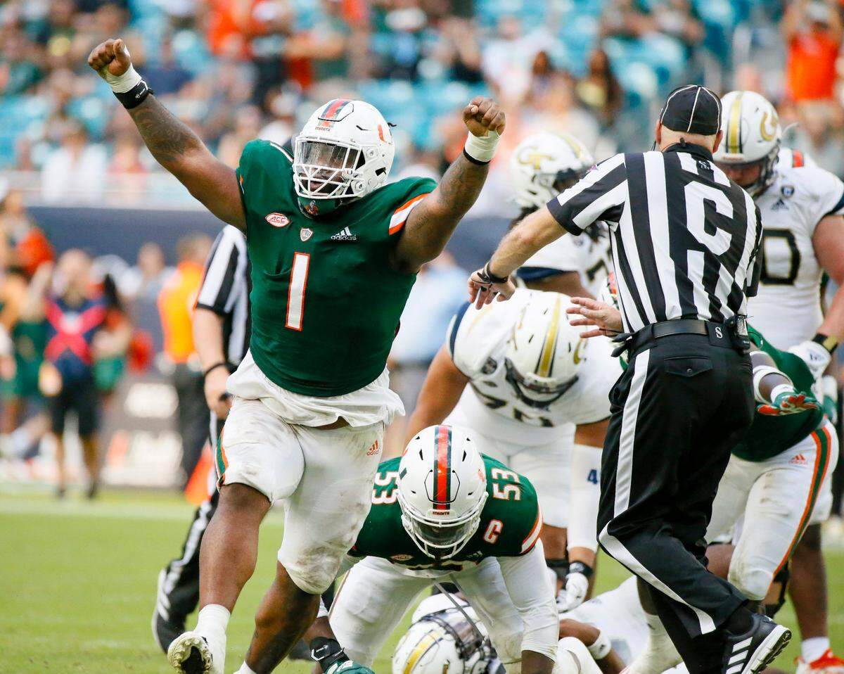 Miami Hurricanes defensive lineman Nesta Jade Silvera (1) reacts after sacking Georgia Tech Yellow Jackets quarterback Jeff Sims (10) during the fourth quarter of their ACC football game at Hard Rock Stadium on Saturday, November 6, 2021 in Miami Gardens, Florida.