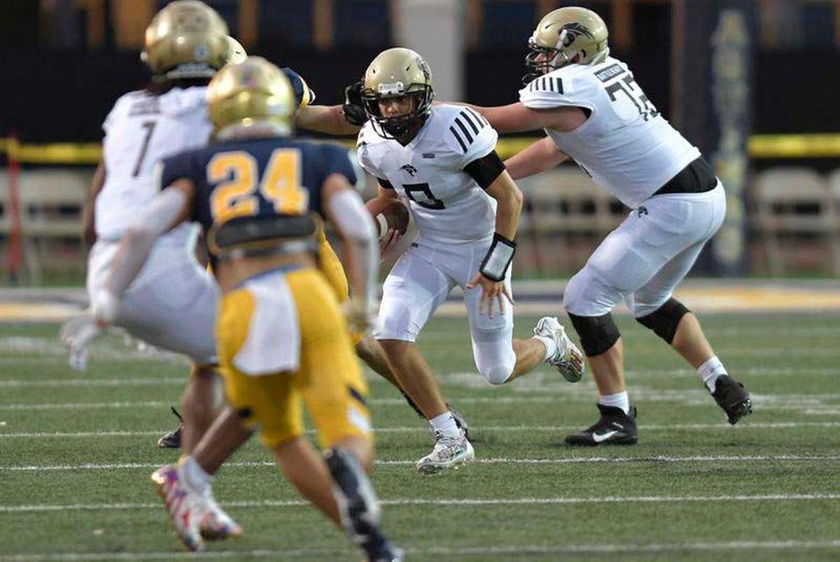 Western quarterback Collin Hurst tries to find room to run against the St. Thomas Aquinas defense during the first half of their game, Friday, September 24, 2021. (Michael Laughlin/Sun Sentinel)