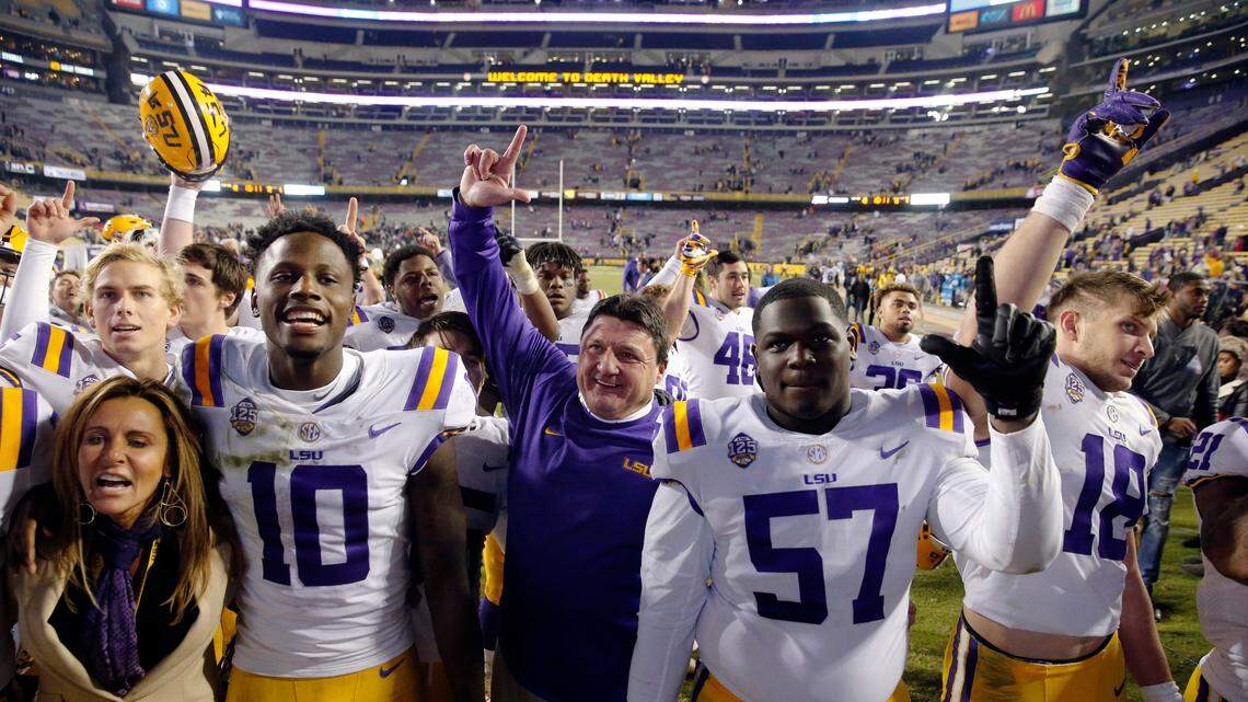 LSU coach Ed Orgeron sings the school alma mater with his team after an NCAA college football game against Rice in Baton Rouge, La., Saturday, Nov. 17, 2018. LSU won 42-10.
