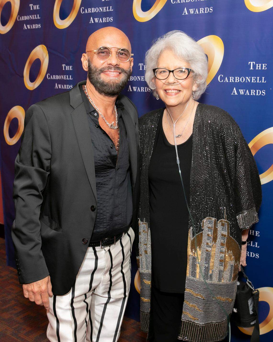 Playwright Nilo Cruz and former Miami Herald theater critic Christine Dolen together at the 2023 Carbonnel Awards.